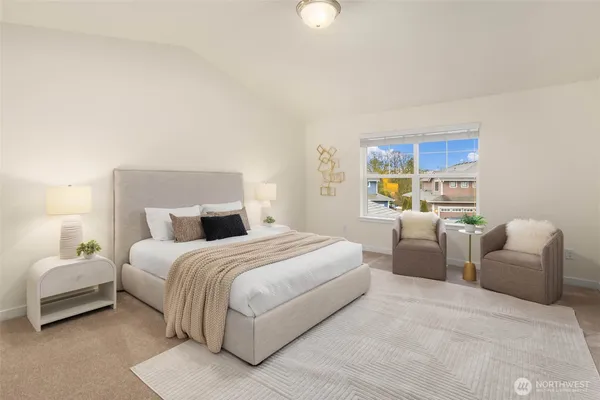 a bedroom with bed and a couch