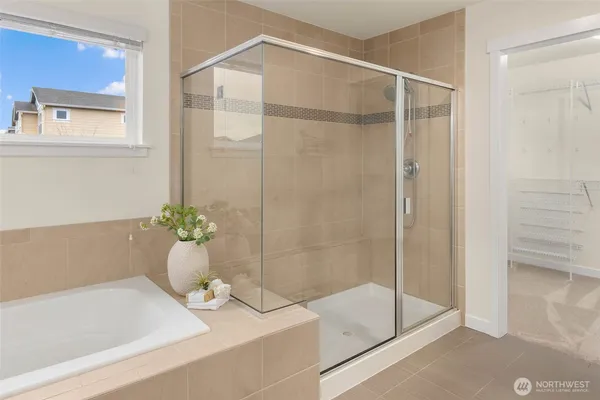 a bathroom with a bathtub and shower