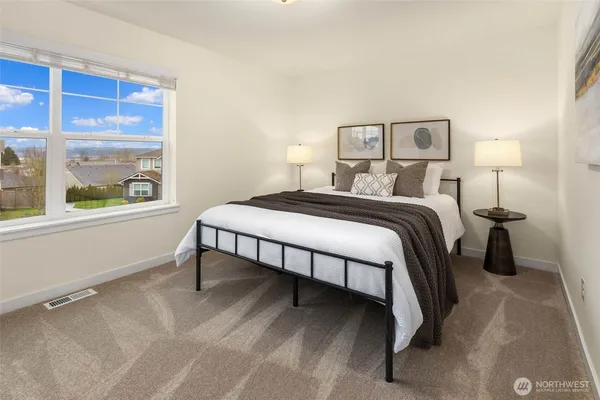 a bedroom with a bed and window