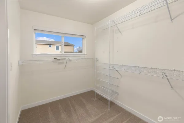 a view of an empty walk in closet
