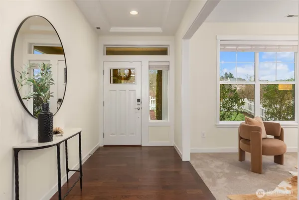 a view of a livingroom with furniture and front door