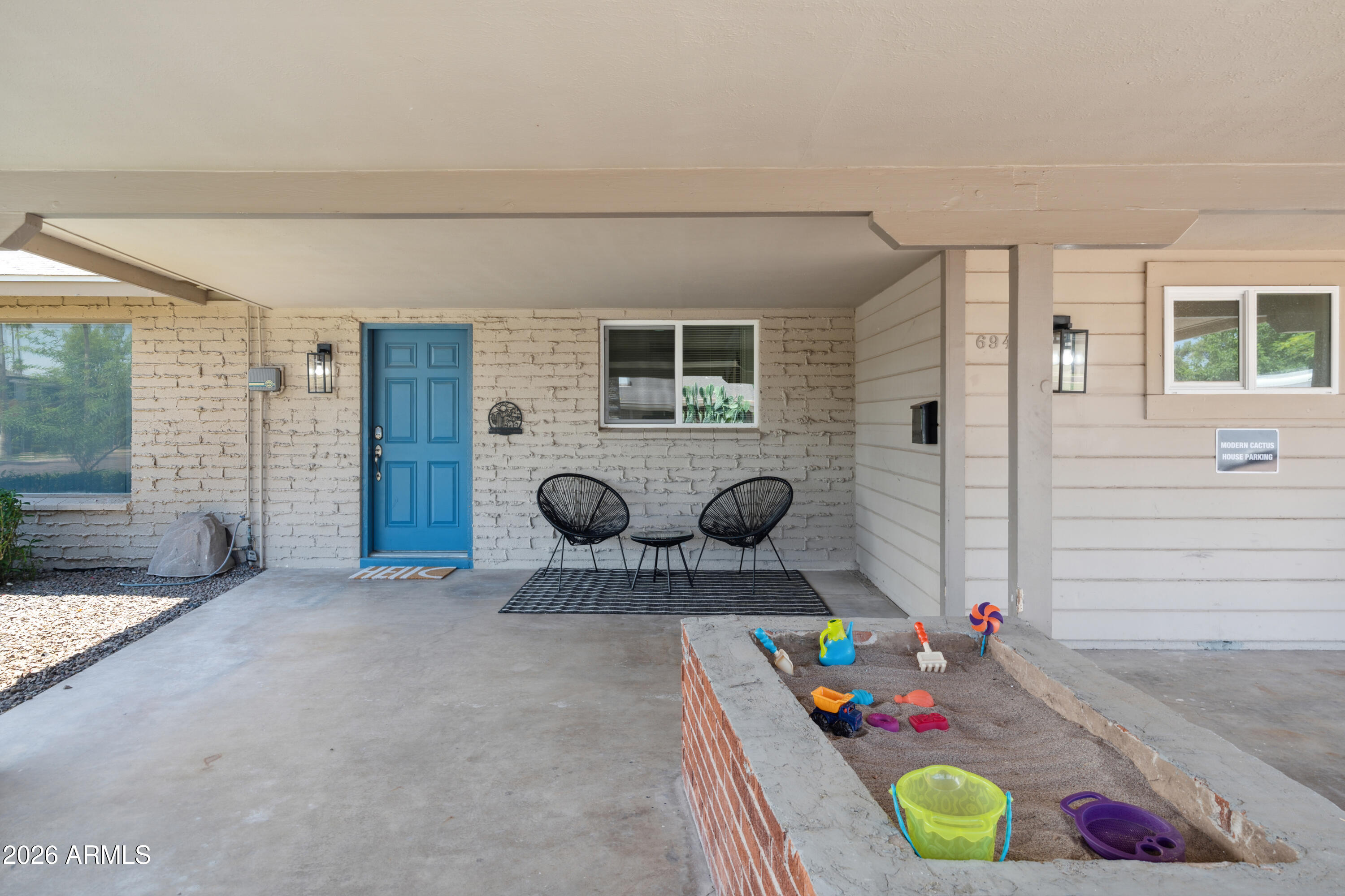 6943 East Granada Road Scottsdale, AZ 85257 - Photo 2 of 19 a living room with furniture and toys