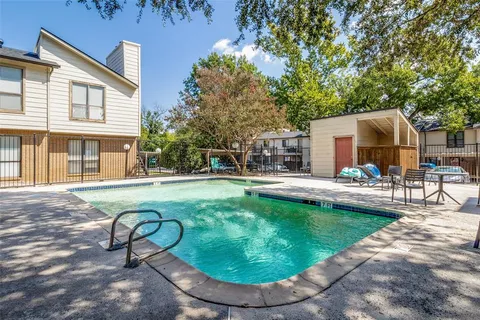 a swimming pool with outdoor seating yard and patio