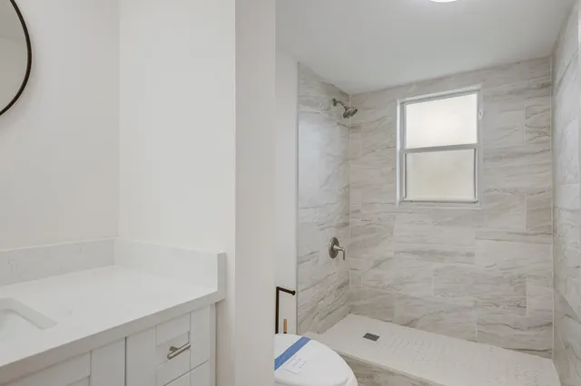 a view of bathroom with a toilet and a sink