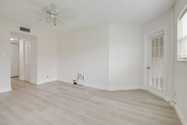 a view of empty room with windows