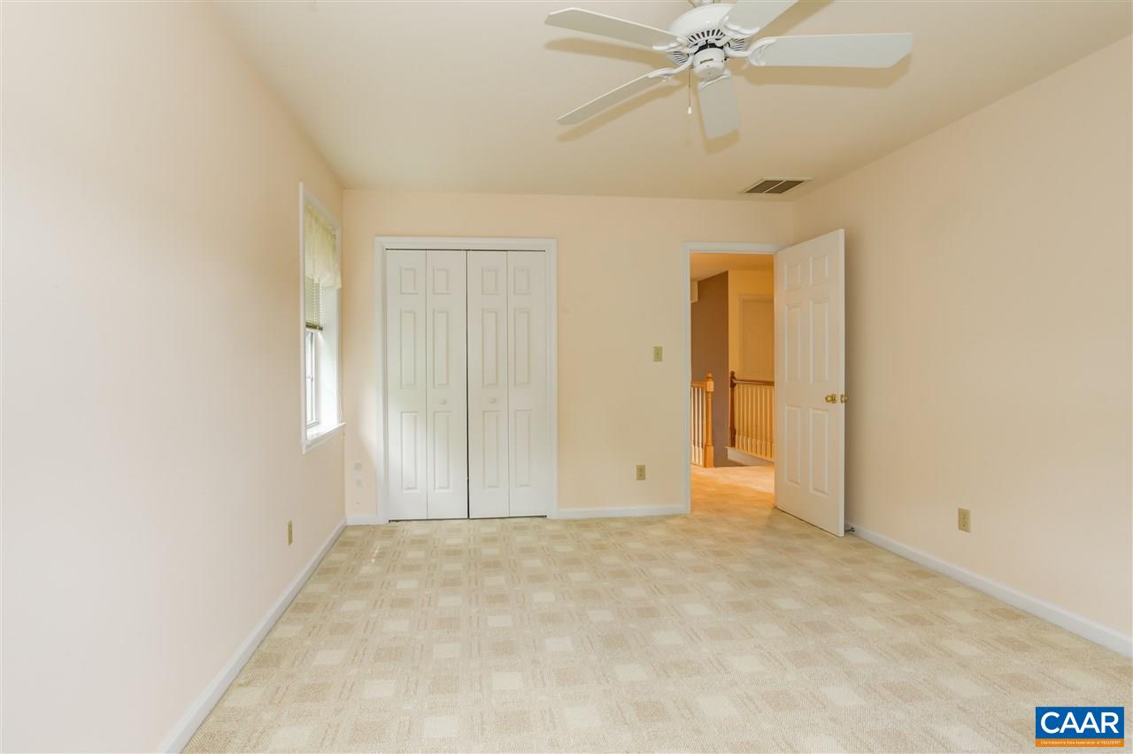 4755 Clover Ridge Court Charlottesville, VA 22901 - Photo 27 of 32 an empty room with a ceiling fan and closet area