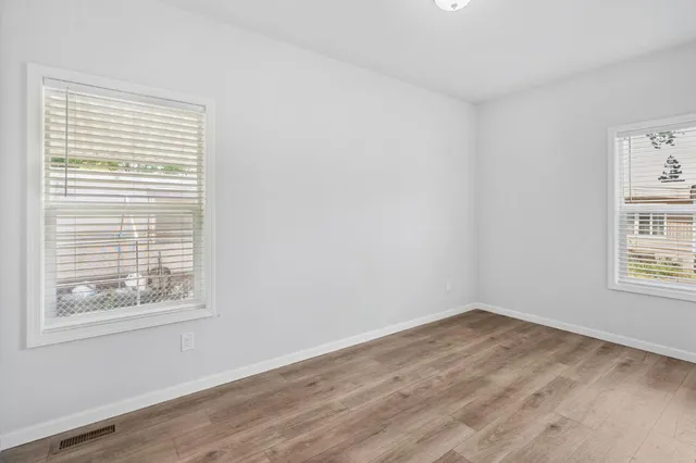 a bathroom with a sink toilet vanity and tub