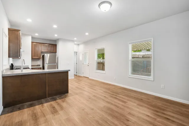 a kitchen with a refrigerator and a sink