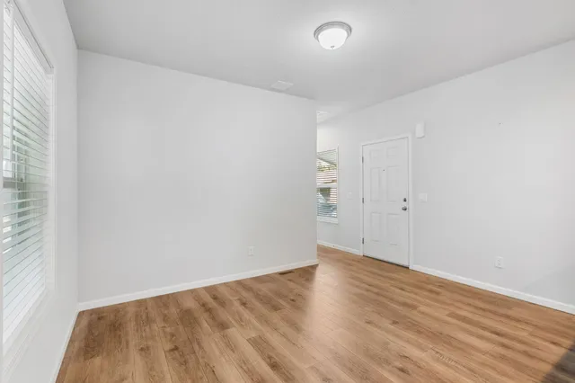 a kitchen that has a refrigerator a stove a sink and a microwave