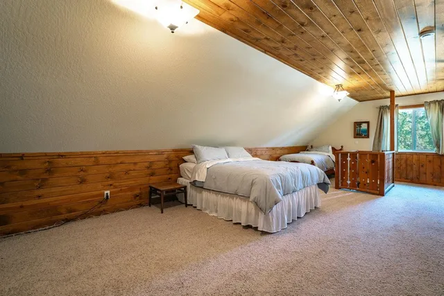 a bed room with a bed and a night stand