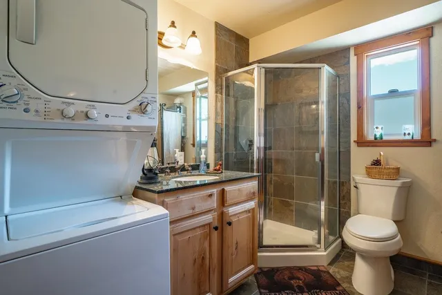 a bathroom with a toilet sink and shower