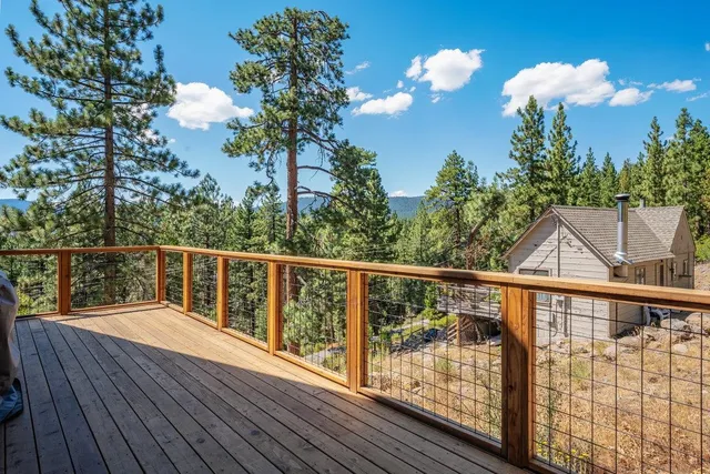 a view of balcony with wooden floor