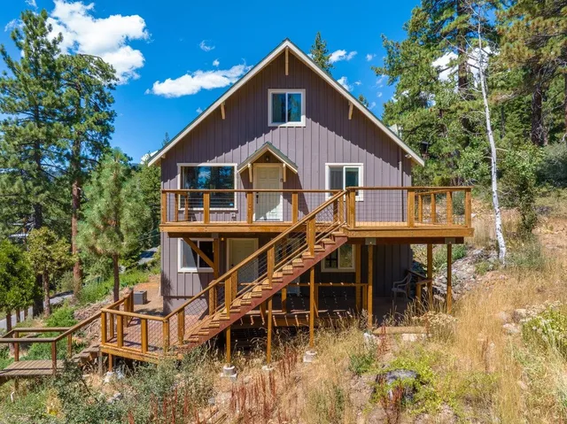 a house view with a wooden floor and outdoor space