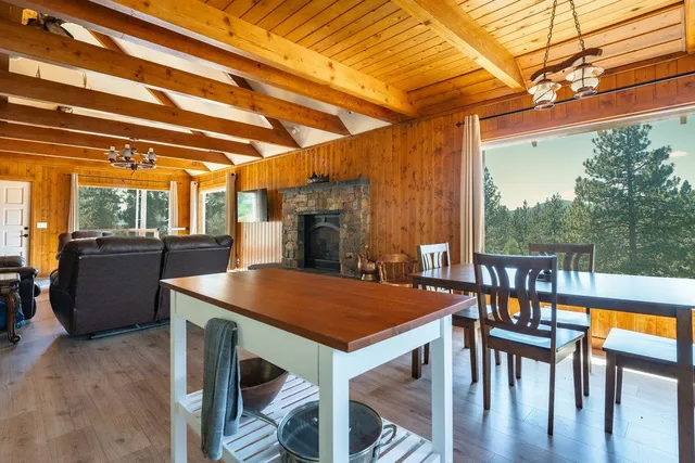 a view of a patio with a table and chairs
