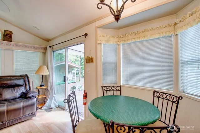 a view of a dining room with furniture window and outside view
