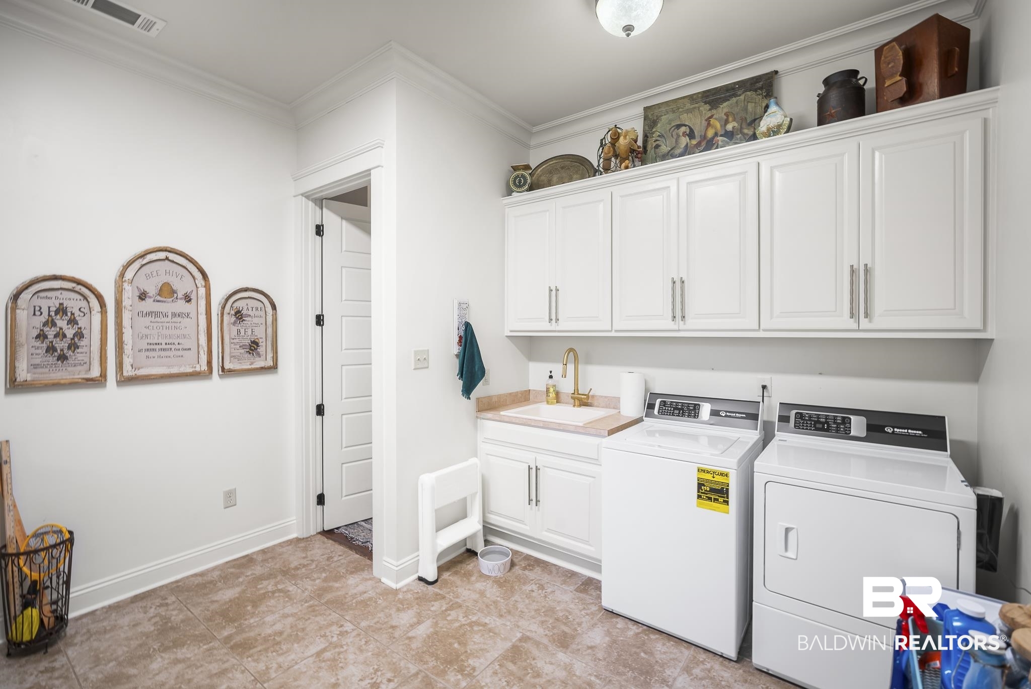 25212 Austin Road Daphne, AL 36526 - Photo 44 of 56 Laundry area featuring separate washer and dryer, crown molding, and cabinet space