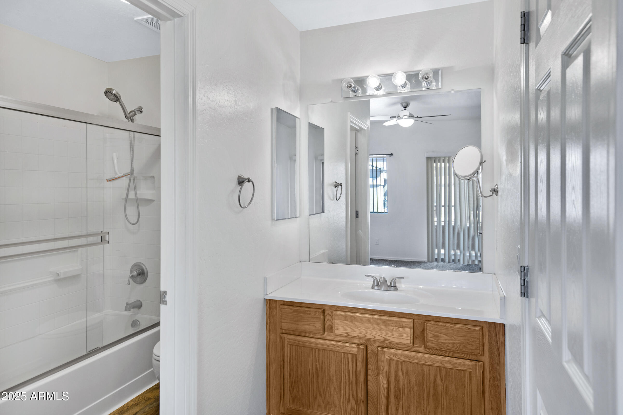 537 South Delaware Drive, Unit 224 Apache Junction, AZ 85120 - Photo 12 of 25 a bathroom with a double vanity sink and a mirror