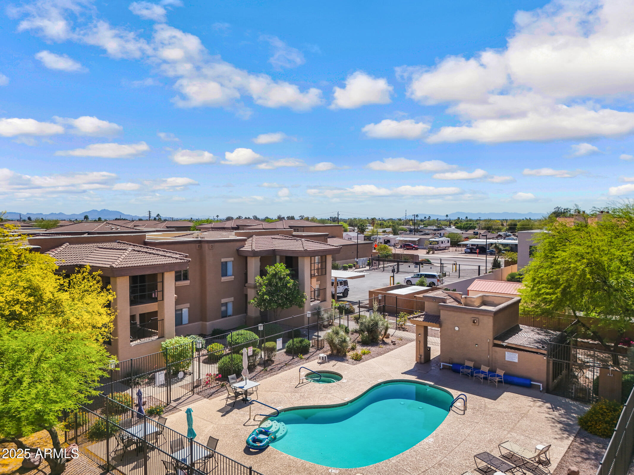 537 South Delaware Drive, Unit 224 Apache Junction, AZ 85120 - Photo 20 of 25 a view of a patio with couches table and chairs and potted plants