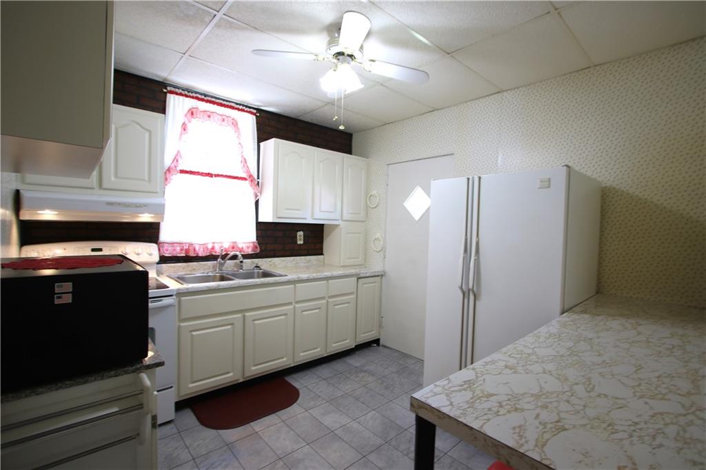 438 North Alexander Monongahela, PA 15063 - Photo 4 of 34 a kitchen with a sink stove and refrigerator