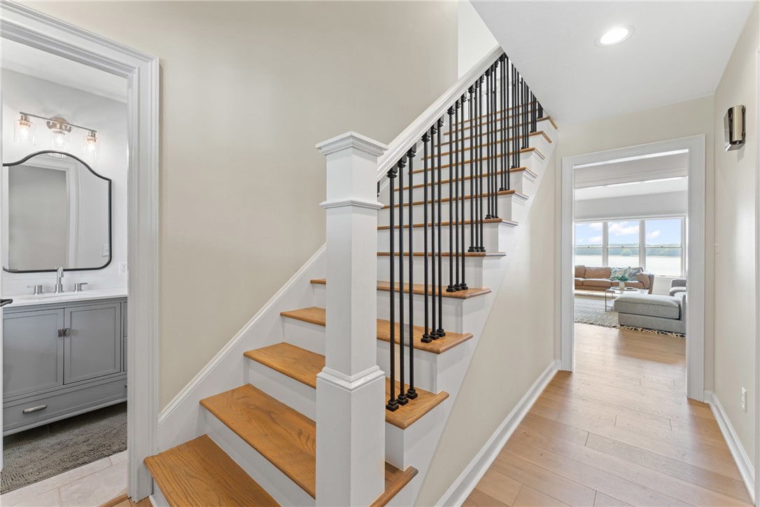 622 Jackson Road Anderson, SC 29626 - Photo 9 of 50 Hardwood stairs with striking iron balusters lead to additional living space.