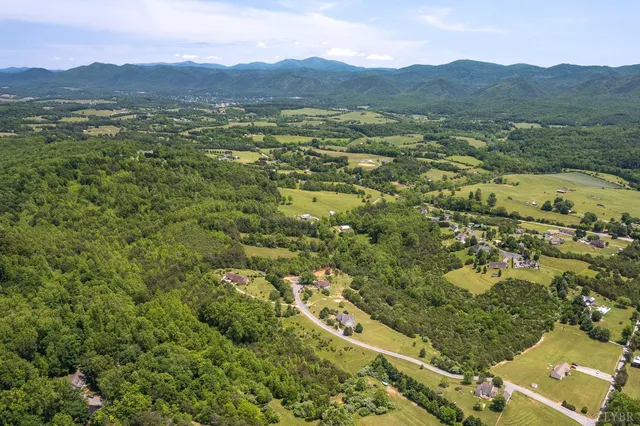 a view of a town with mountains in the background