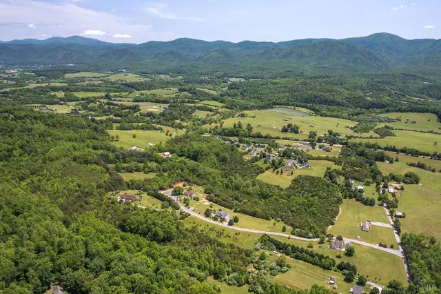 a view of a town with mountains in the background