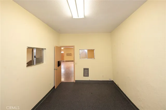 a view of empty room with windows