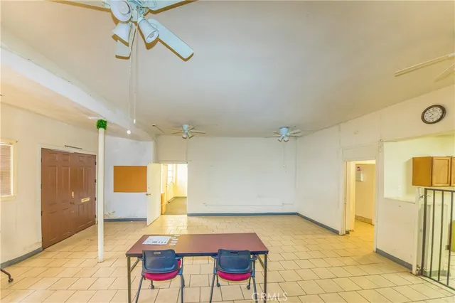 a very nice looking room with a wooden floor and a ceiling fan