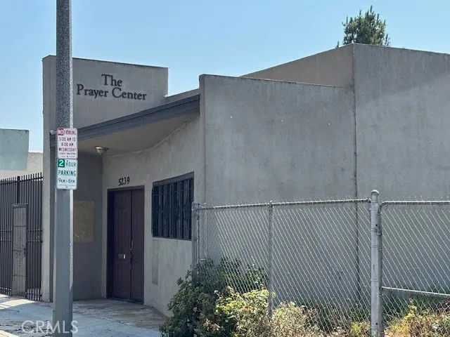 a view of an empty room and a window