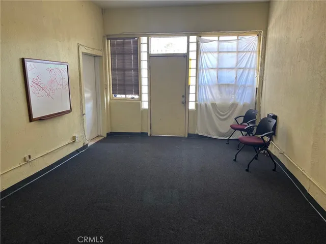 a room with windows and wooden walls