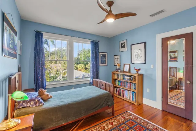 a bedroom with a bed furniture and a window