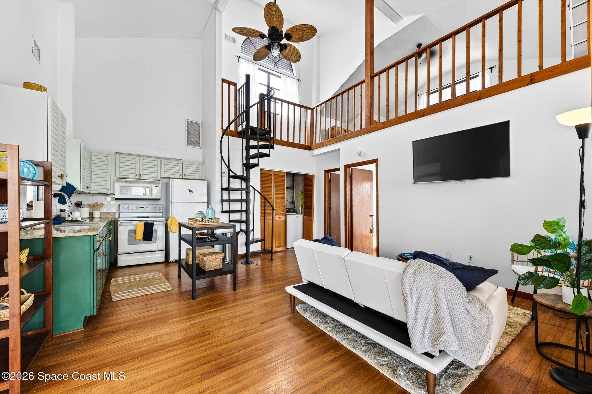 51 Vip Island, Unit B Grant, FL 32949 - Photo 13 of 49 a living room with furniture and a flat screen tv