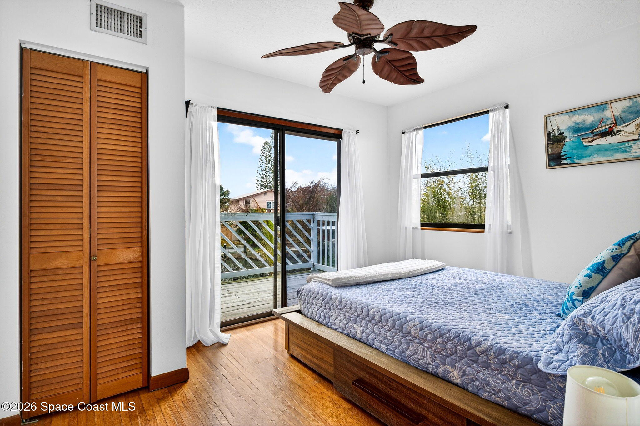 51 Vip Island, Unit B Grant, FL 32949 - Photo 20 of 49 a bedroom with a bed and a window