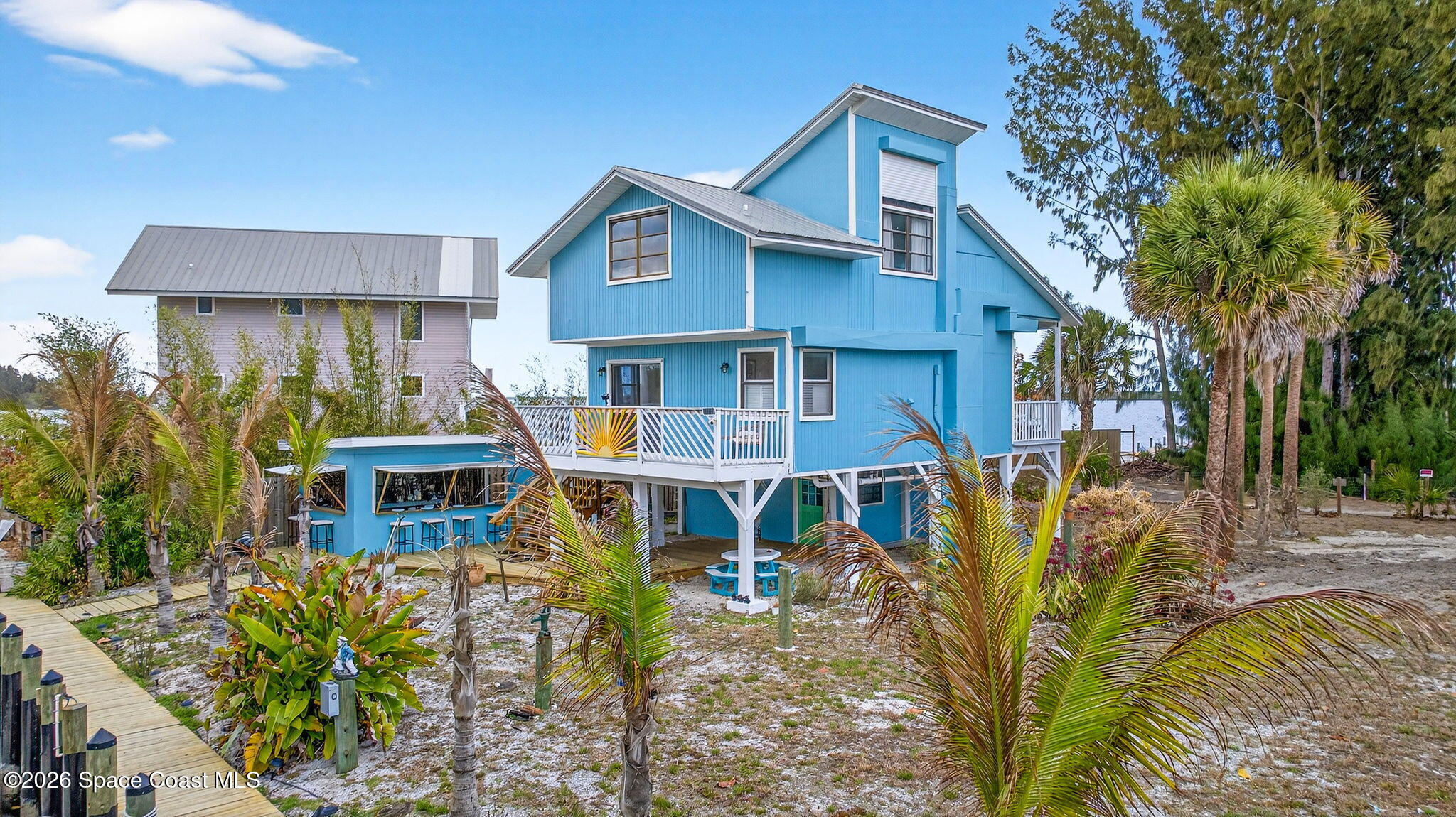 51 Vip Island, Unit B Grant, FL 32949 - Photo 2 of 49 a view of a house with pool and sitting area
