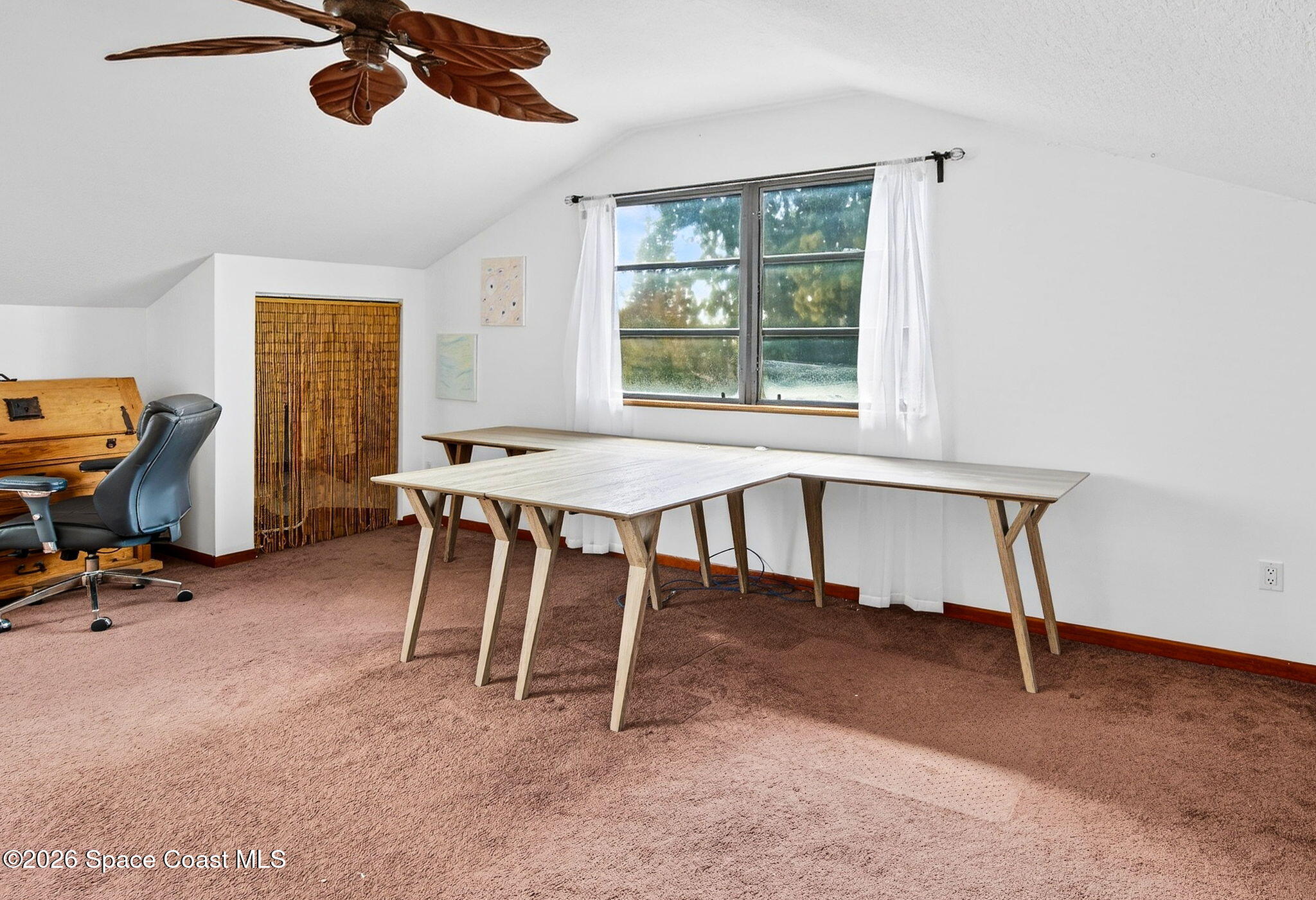 51 Vip Island, Unit B Grant, FL 32949 - Photo 24 of 49 a workspace with furniture and a window