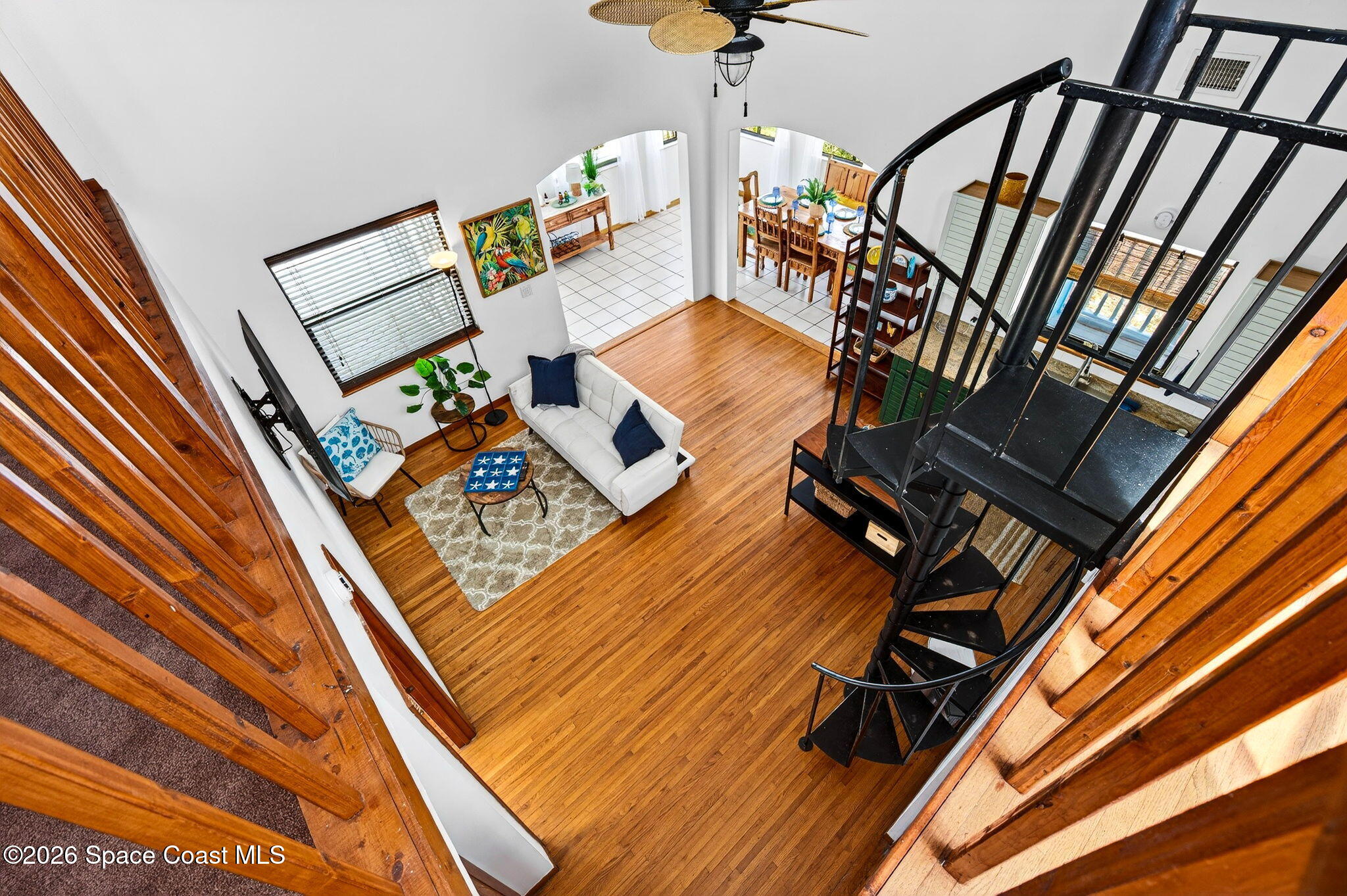 51 Vip Island, Unit B Grant, FL 32949 - Photo 25 of 49 a view of an chairs and table on the wooden floor