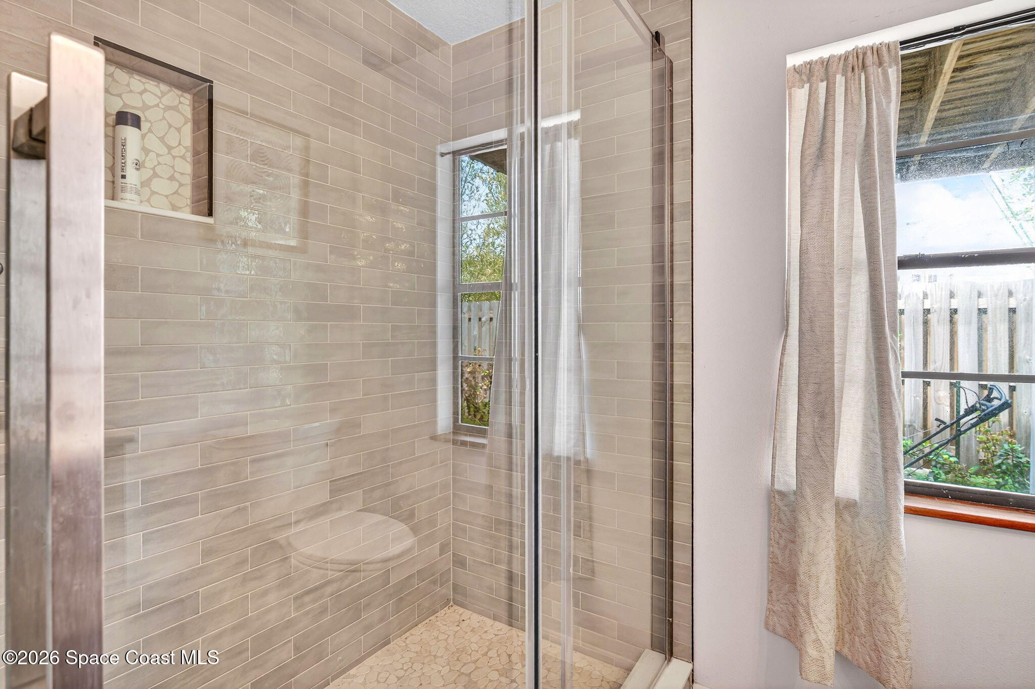 51 Vip Island, Unit B Grant, FL 32949 - Photo 35 of 49 a bathroom with a shower and a sink