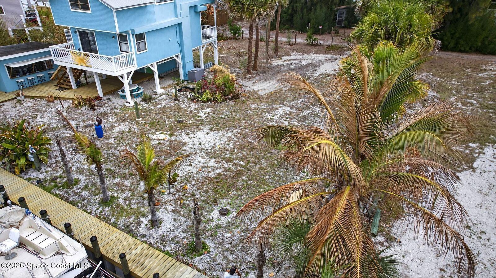 51 Vip Island, Unit B Grant, FL 32949 - Photo 49 of 49 a view of a yard with plants and large trees