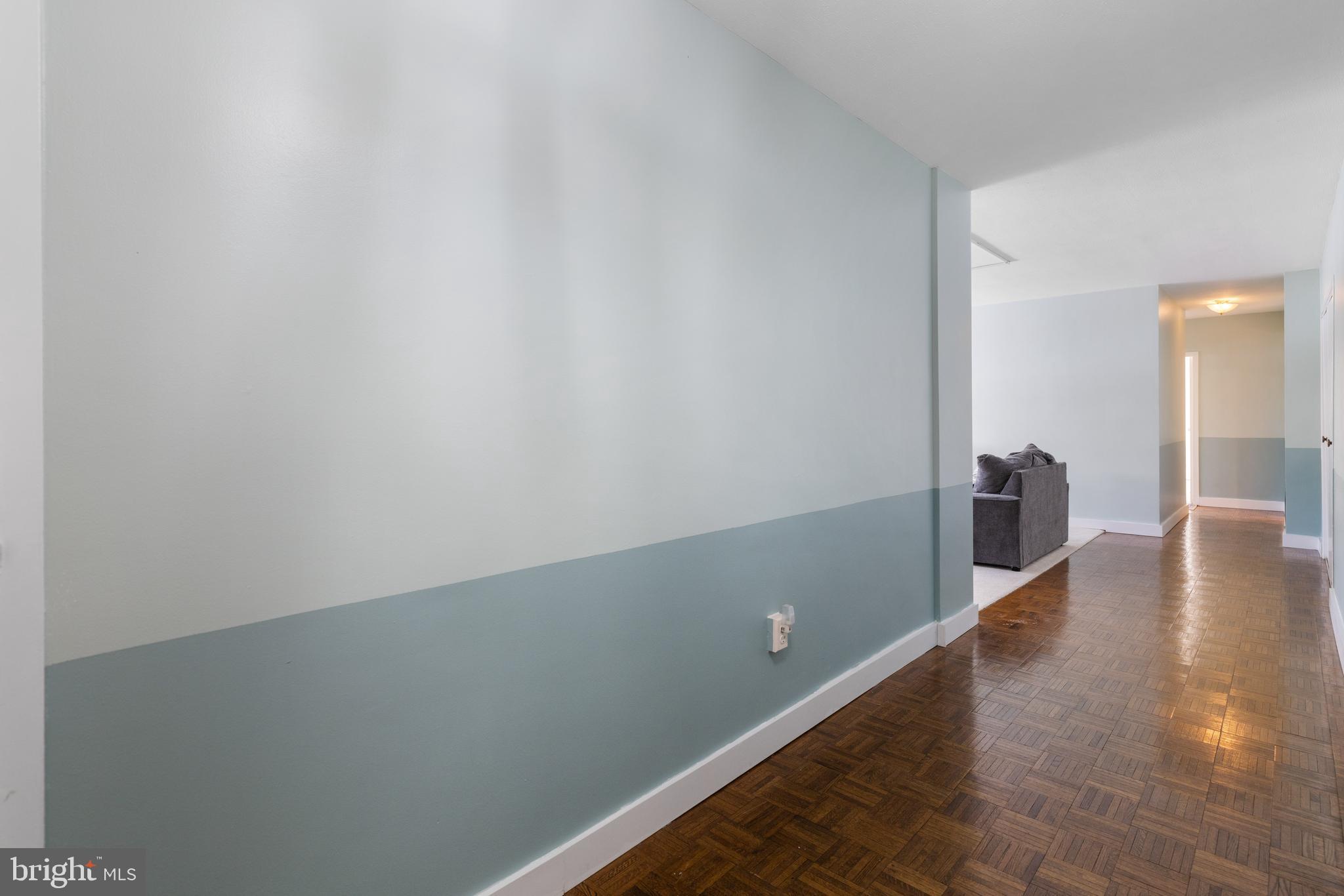 7900 Old York Road, Unit 303B Elkins Park, PA 19027 - Photo 12 of 27 a view of a hallway with wooden floor