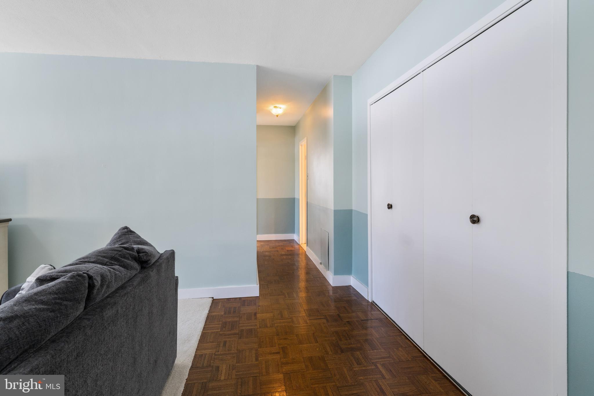 7900 Old York Road, Unit 303B Elkins Park, PA 19027 - Photo 13 of 27 a living room with furniture and a walk in closet