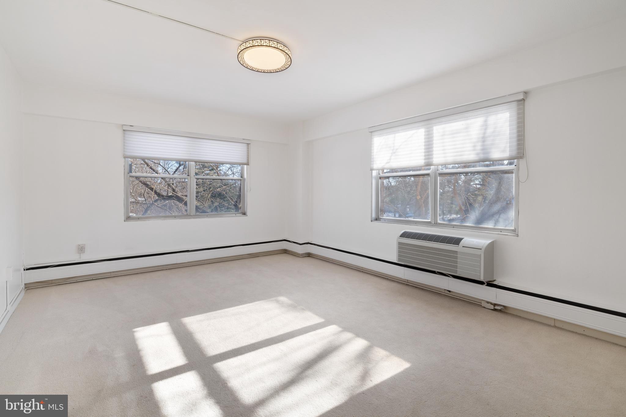 7900 Old York Road, Unit 303B Elkins Park, PA 19027 - Photo 17 of 27 a view of an empty room with a window
