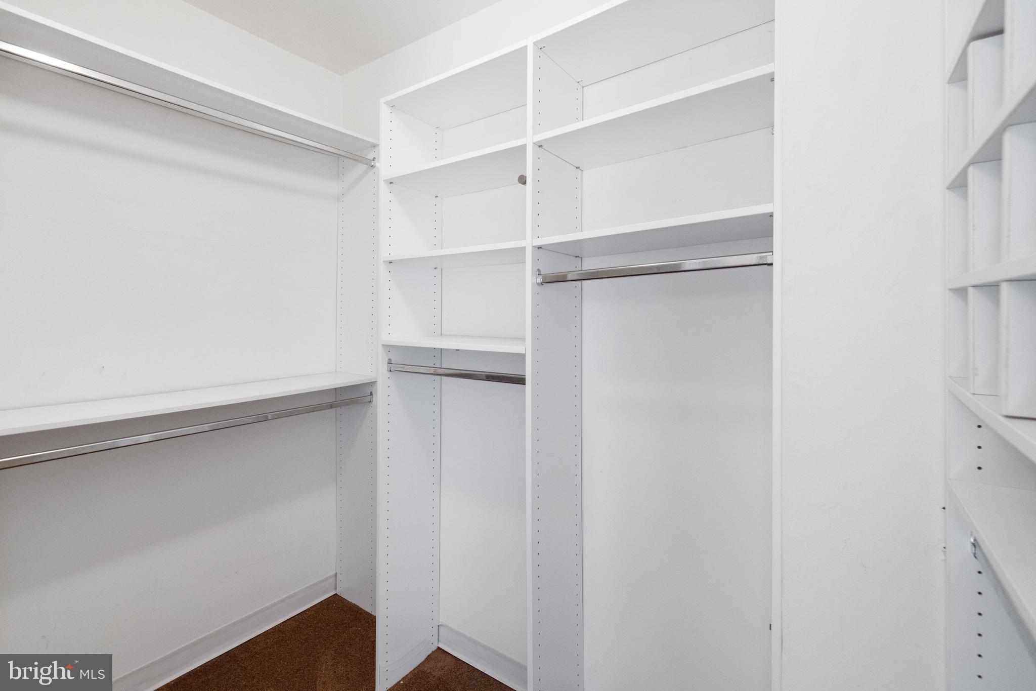 7900 Old York Road, Unit 303B Elkins Park, PA 19027 - Photo 19 of 27 a view of walk in closet with empty racks