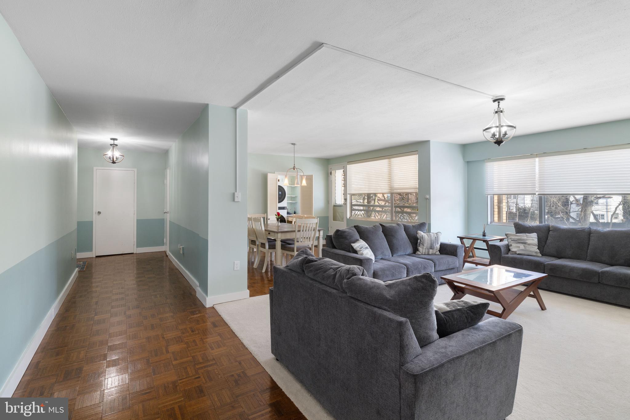 7900 Old York Road, Unit 303B Elkins Park, PA 19027 - Photo 3 of 27 a living room with furniture and a large window