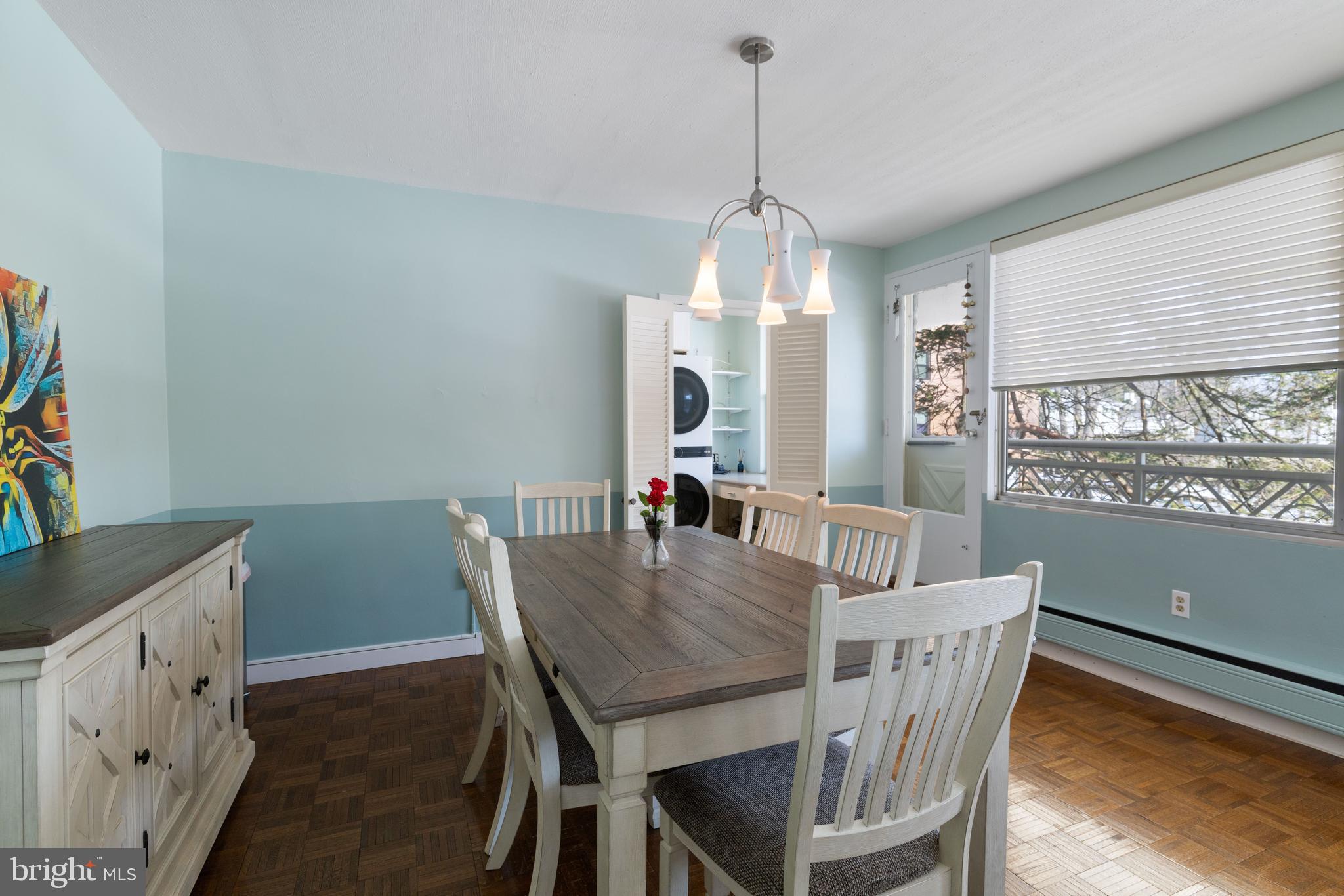 7900 Old York Road, Unit 303B Elkins Park, PA 19027 - Photo 7 of 27 a view of a dining room with furniture window and wooden floor