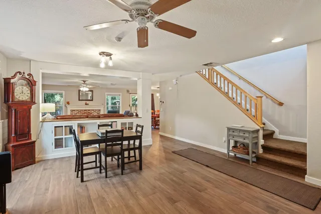 a view of a livingroom with furniture window and wooden floor