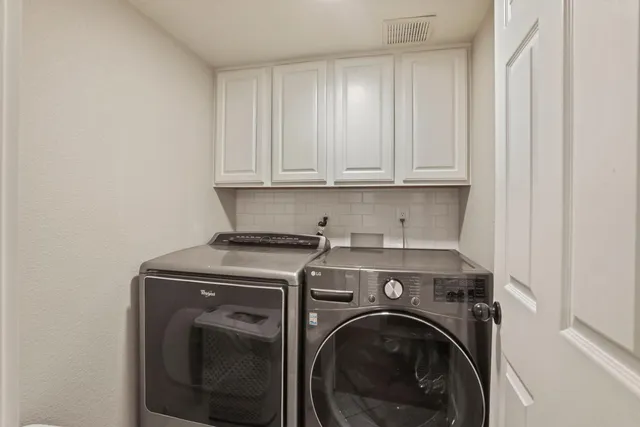 a bathroom with a sink vanity and toilet