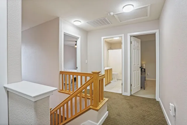 a bathroom with a double vanity sink toilet and a mirror