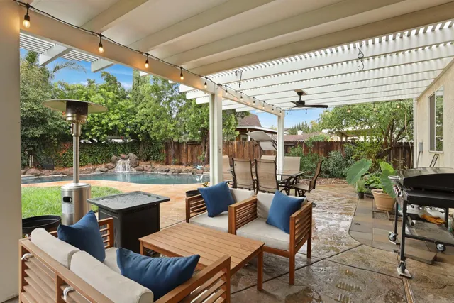 a view of a swimming pool with a patio