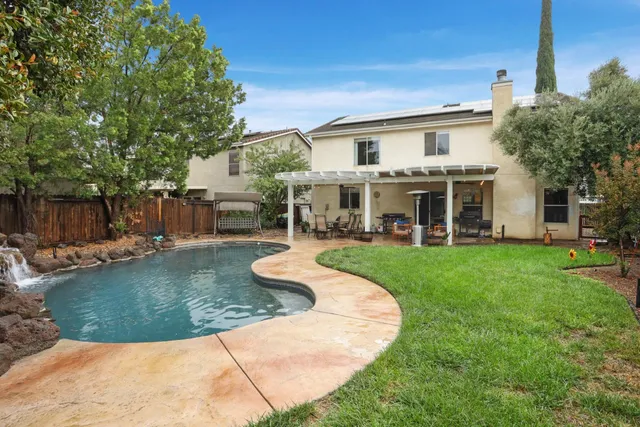 a view of a swimming pool with a patio