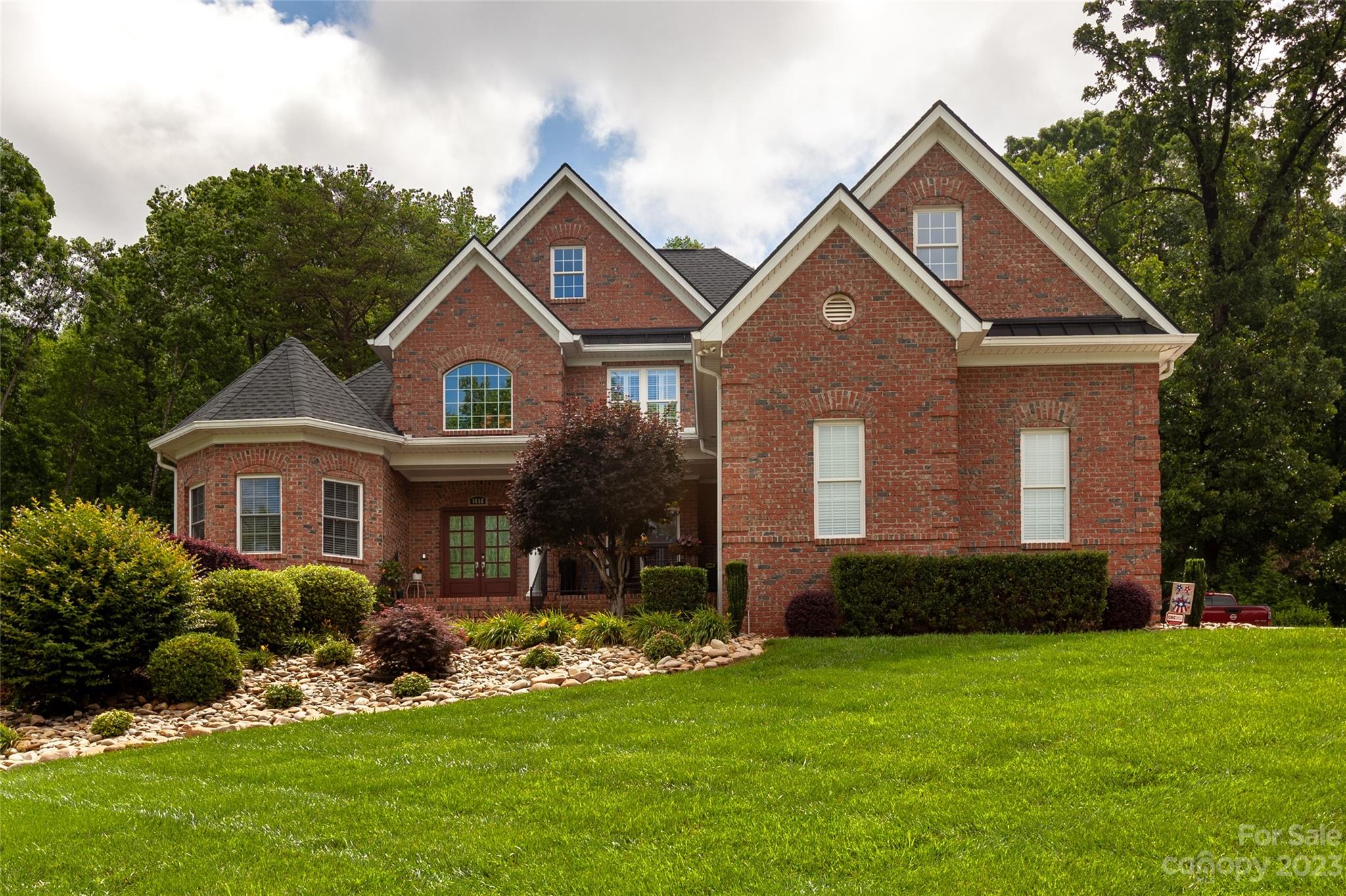 a front view of a house with a yard